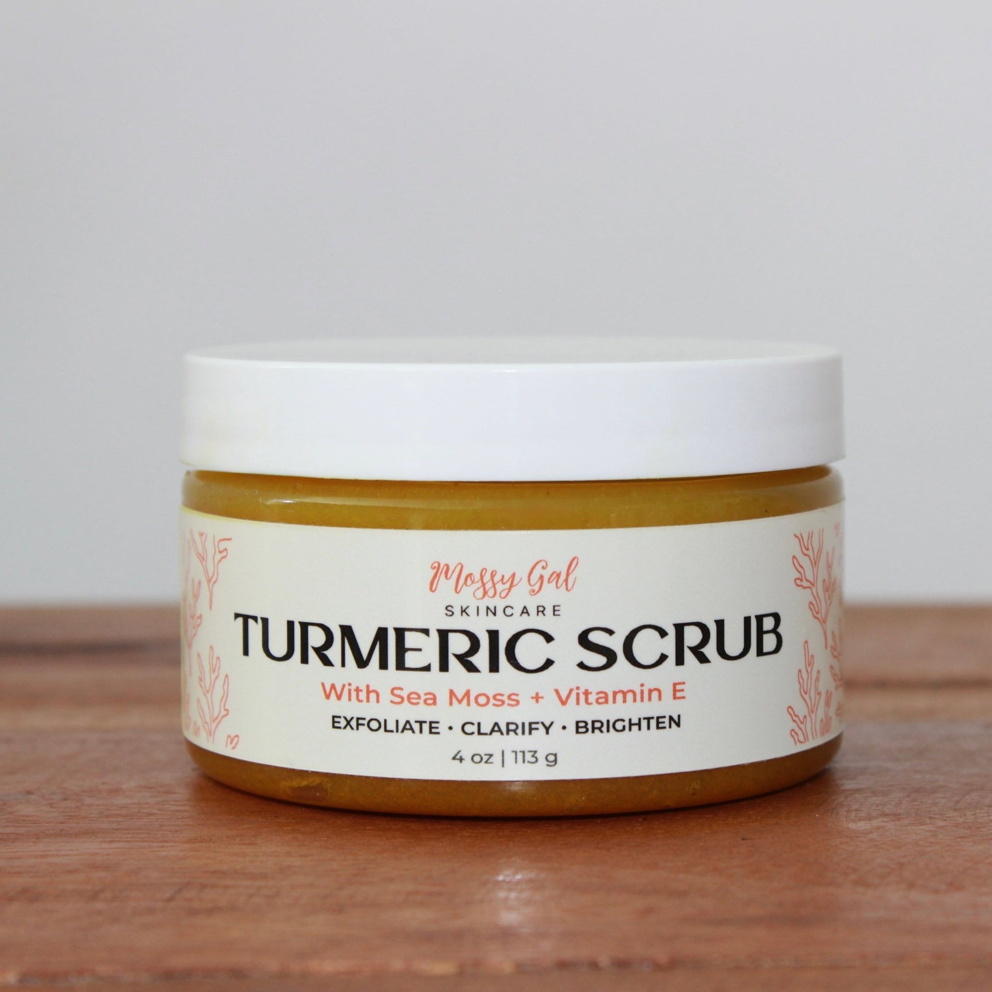 Mossy Gal Turmeric Scrub in cosmetic jar with white lid