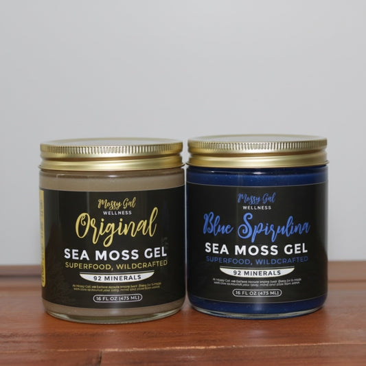 Mossy Gal Original and Blue Spirulina sea moss gel jars displayed side by side on a wooden surface