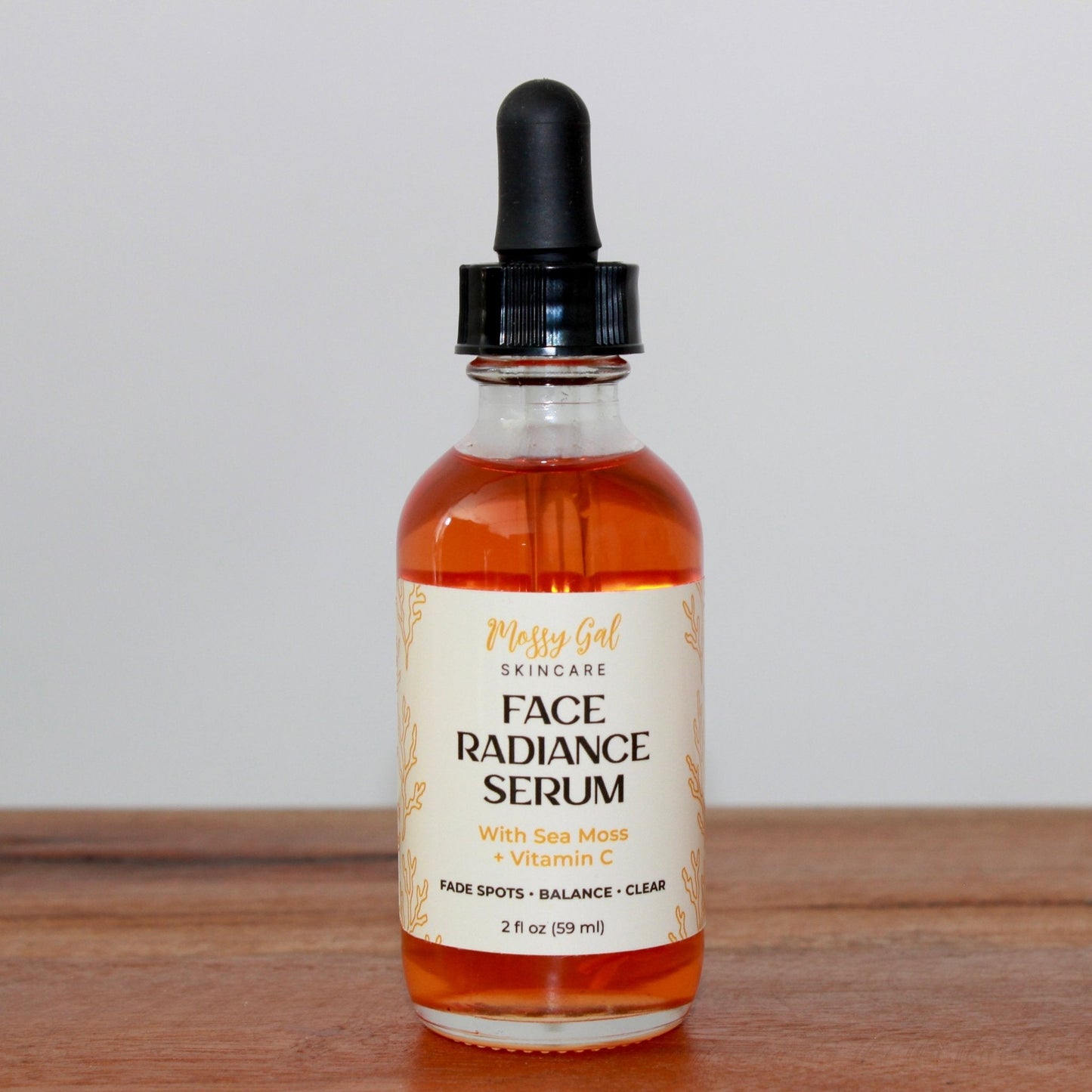 Mossy Gal Face Radiance Serum in glass dropper bottle.