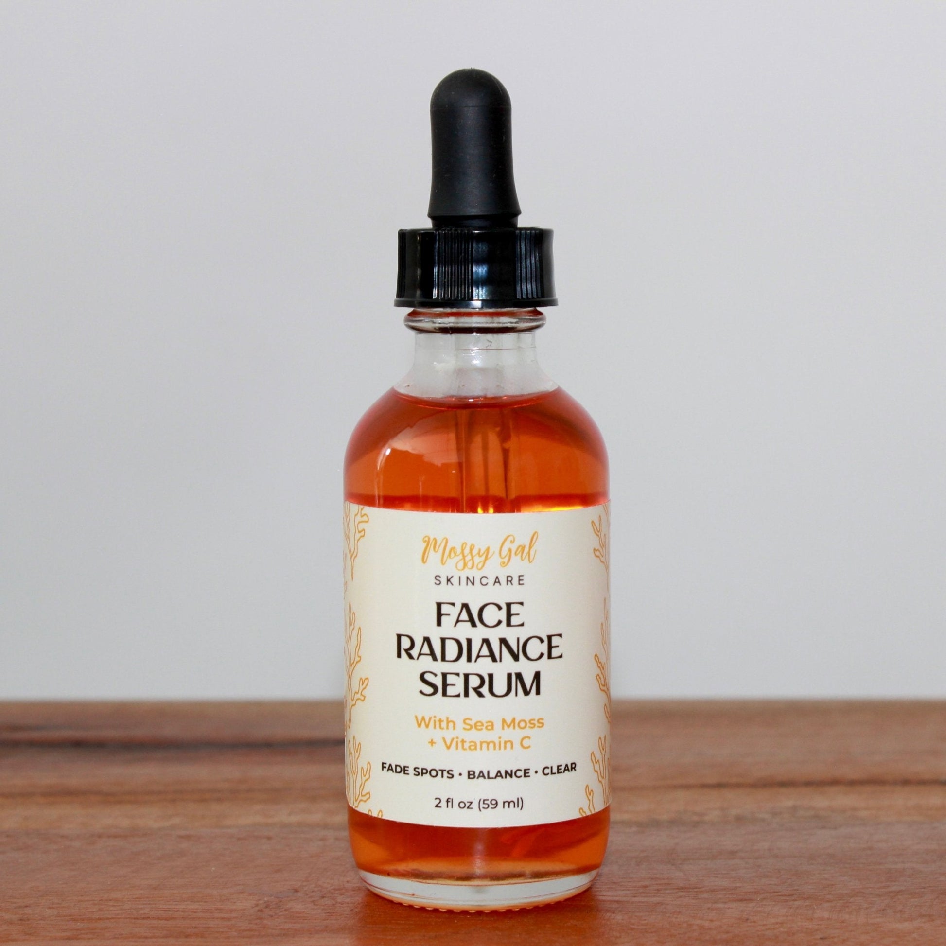 Mossy Gal Face Radiance Serum in glass dropper bottle.