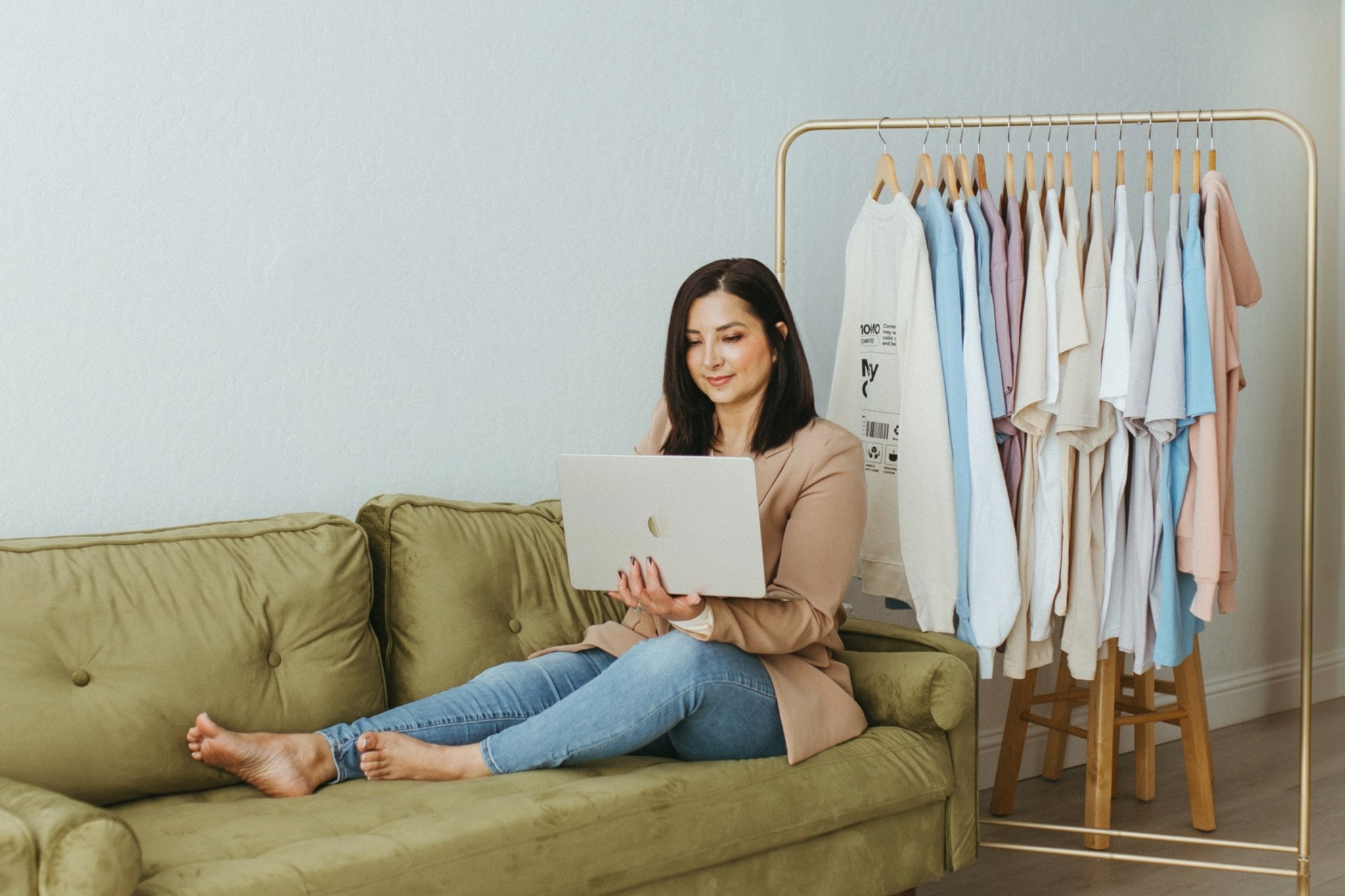 Mossy Gal founder sitting at home workspace with warm natural light.