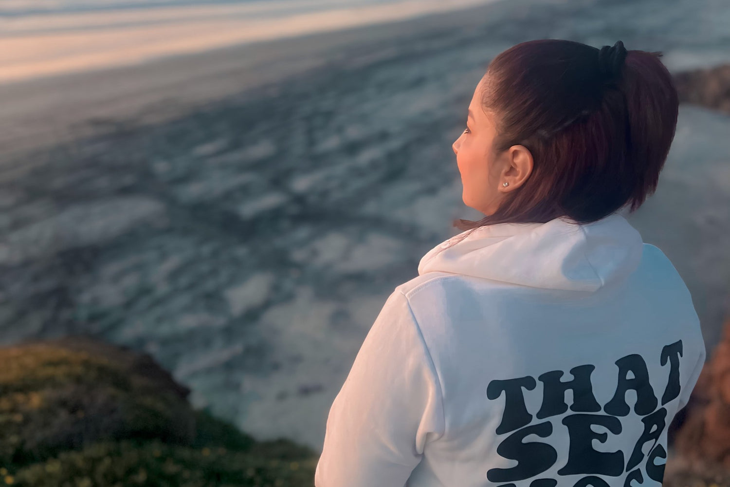 Mossy Gal founder outdoors overlooking mountains, symbolizing faith and freedom.