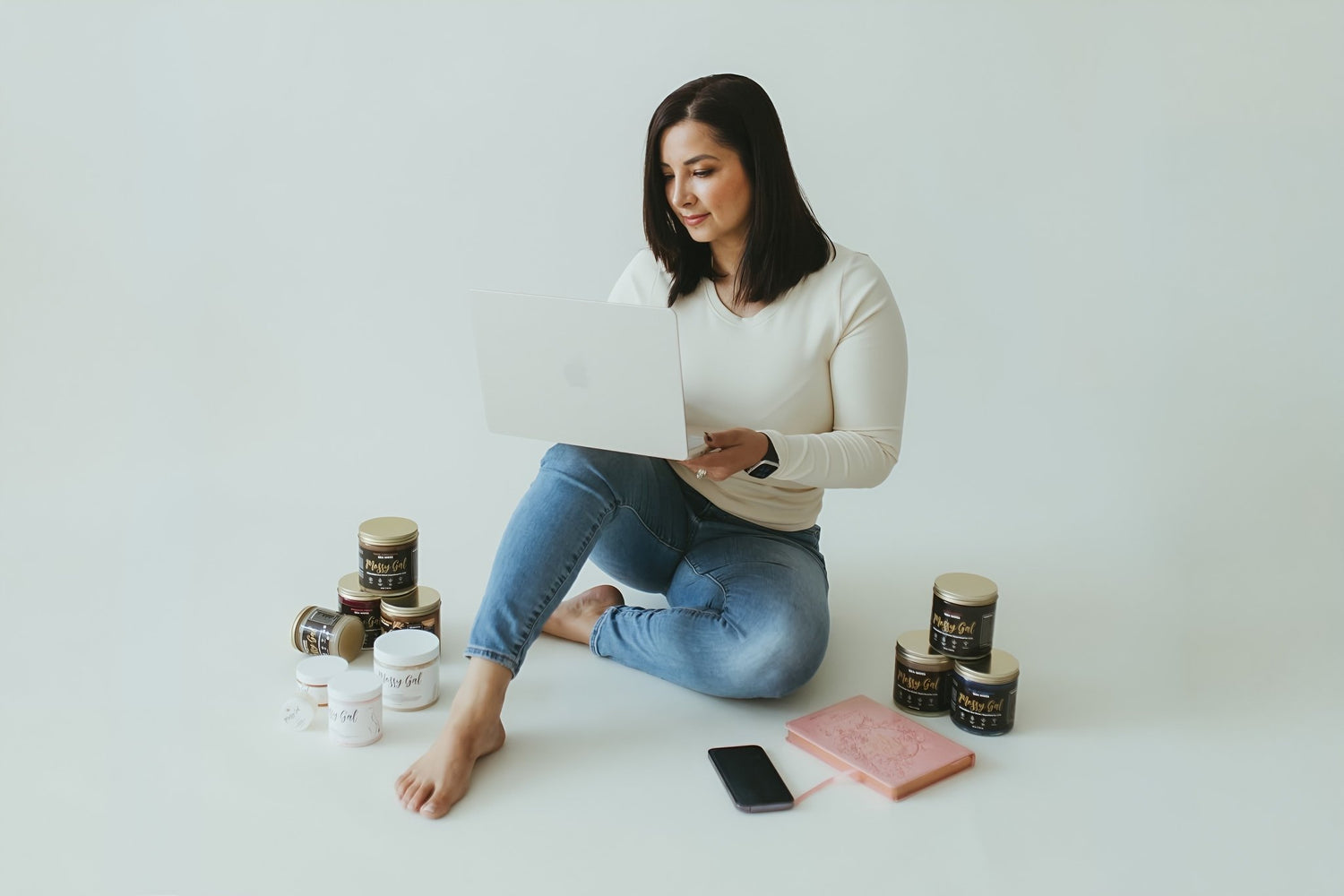 Mossy Gal founder in photography studio with products.