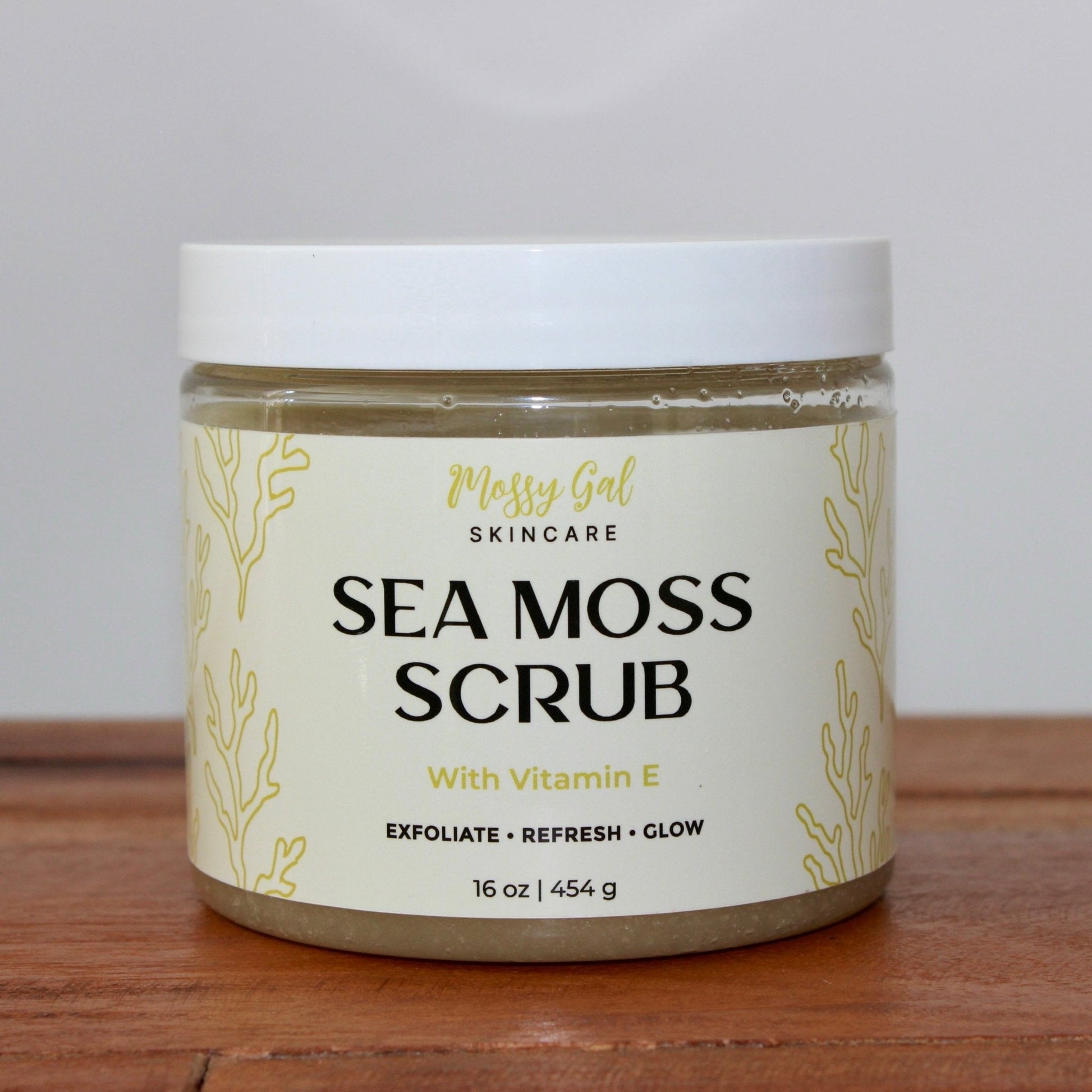 Mossy Gal Sea Moss Face Scrub in cosmetic jar with white  lid.